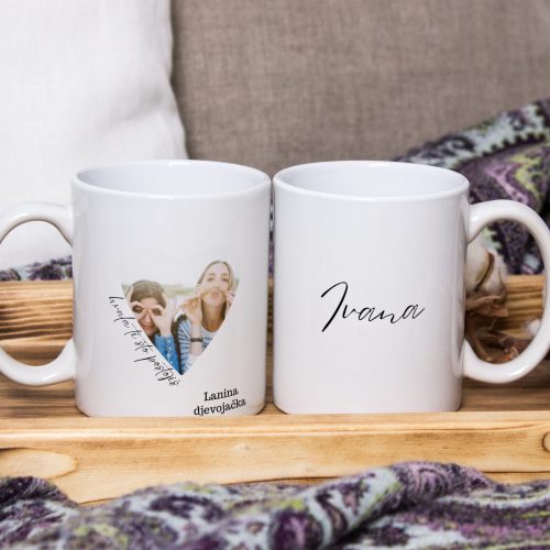 Two white mugs, pair of cups on a wooden tray, the Mockup. Cozy home, wooden background, cotton and wool decorations, winter gifts.
